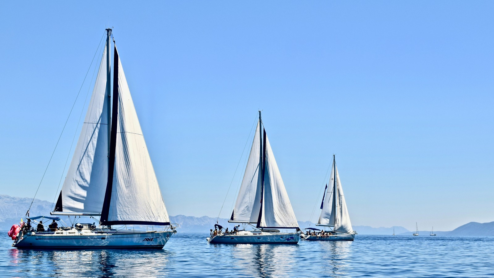 trio of yachts sail the  Dalmatian Coast, Croatia.