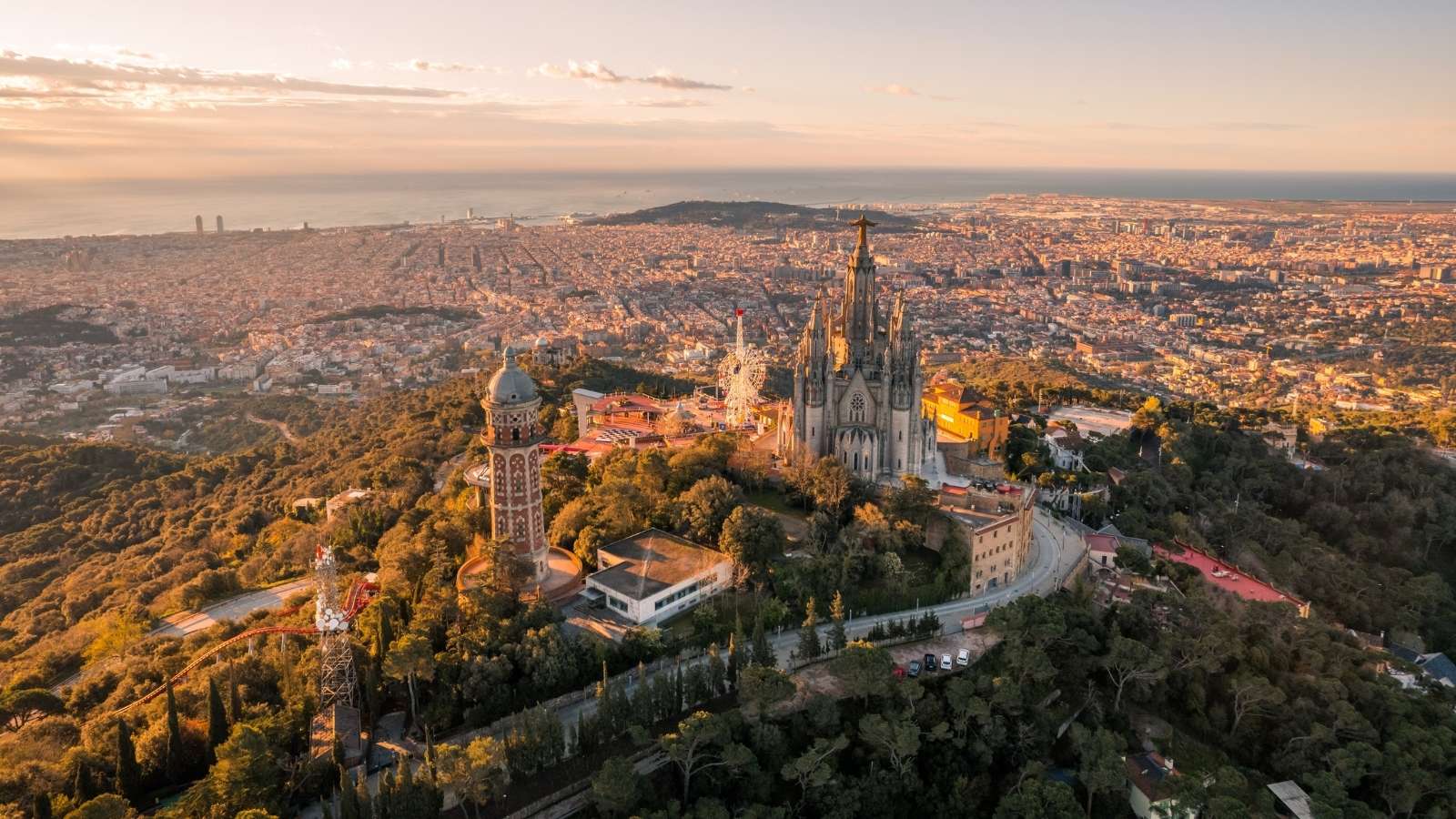 Aerial view of Barcelona skyline with Sagrat Cor temple during sunrise