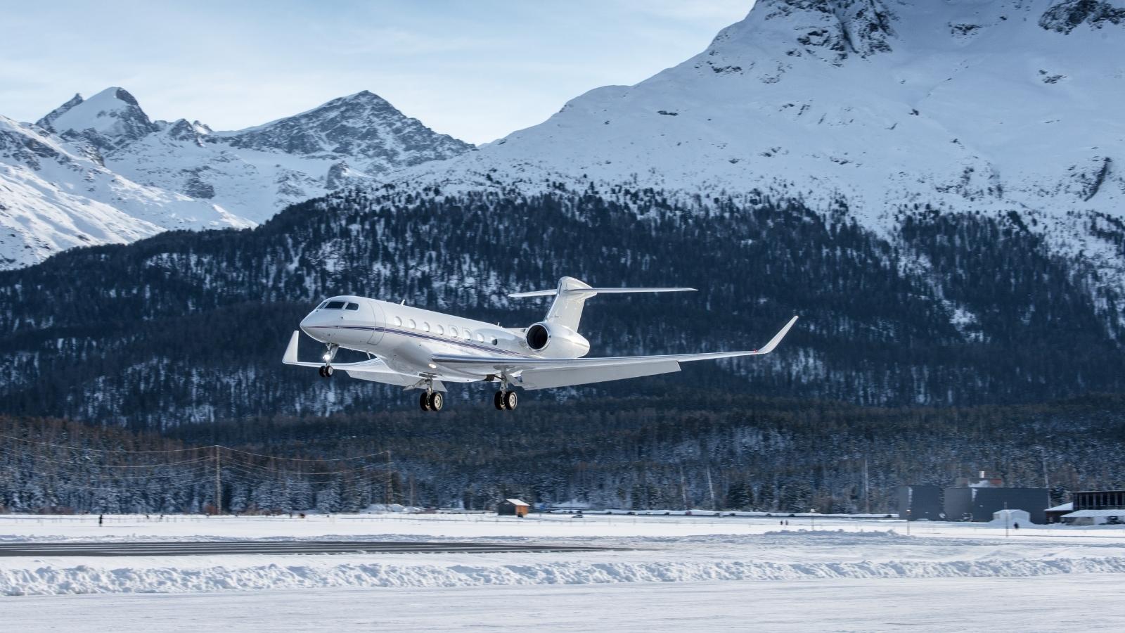 Business jet Landing at an airfield in the mountains of Switzerland.