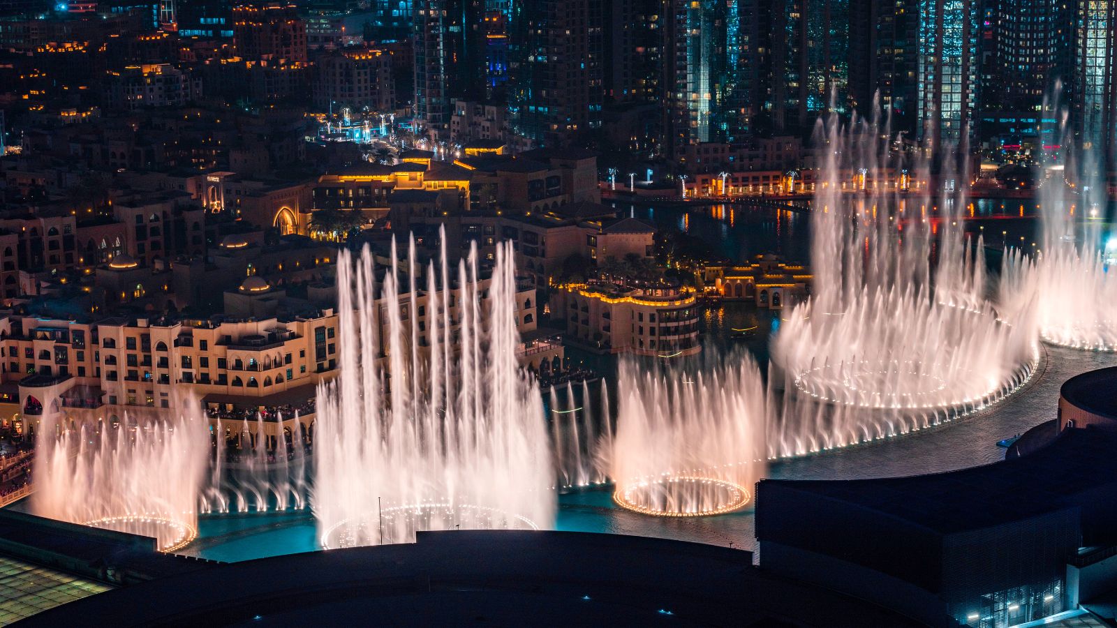 Dubai Dancing Fountain show at night. Tourist attraction. Luxury travel destination