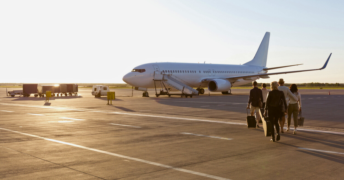 group boarding private aircraft