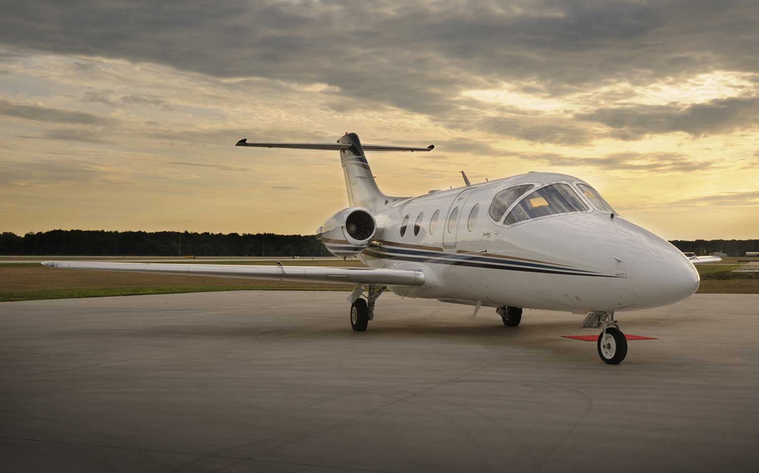Hawker 400XP private jet charter on runway