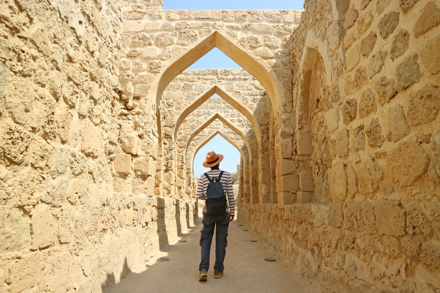 Man walking through ruins