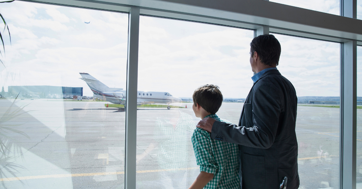 men and boy waiting for private jet