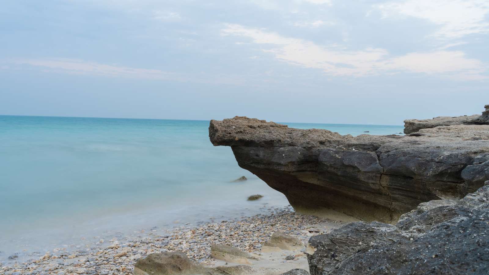 Beautiful Jebel Fuwairit Beach landscape with pebbles in Qatar.